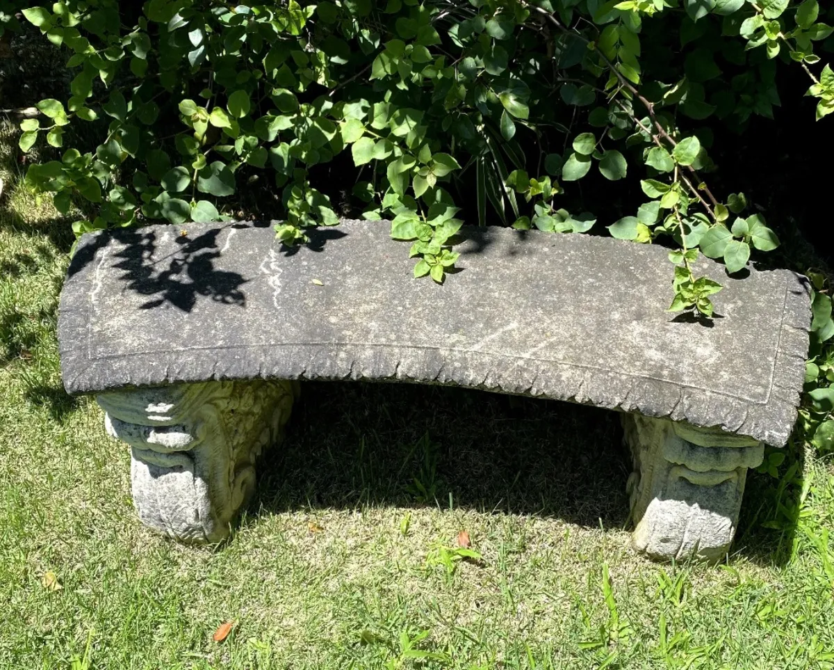 Stone garden bench before cleaning — weathered grey with moss and grime